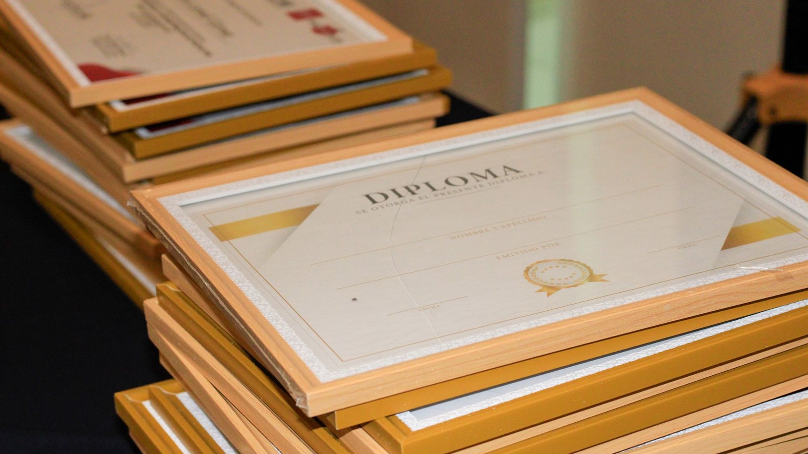A stack of framed certificates, representing the documented evidence behind a claimed skill